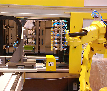 Integrating Robots with Injection Molding Machines